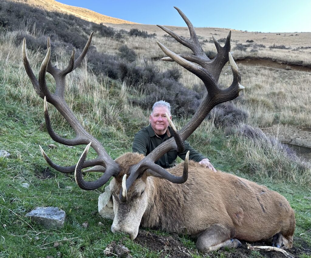 man posing with animal