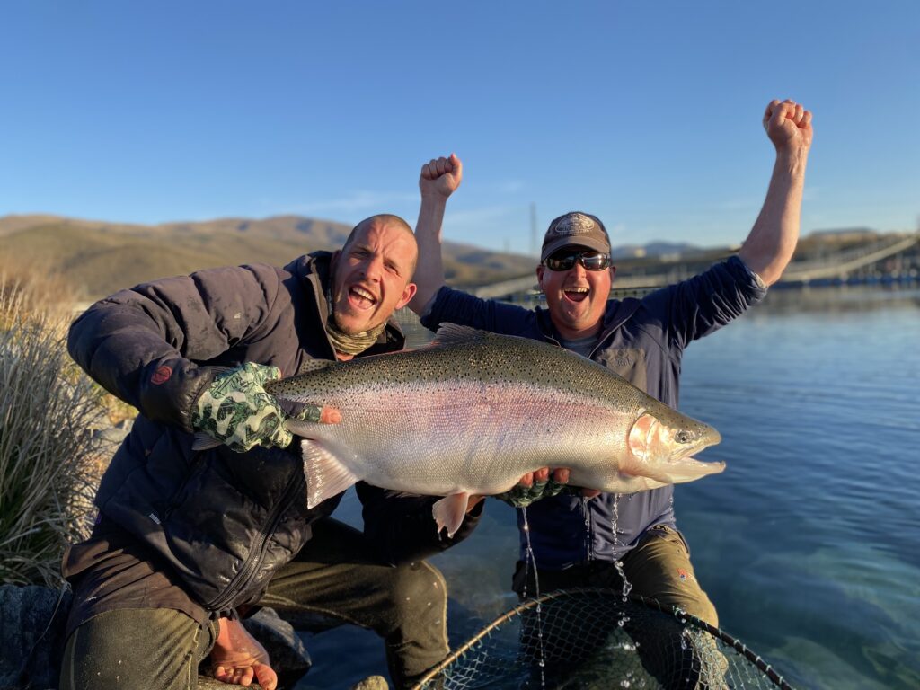 two men excited about catching a big fish