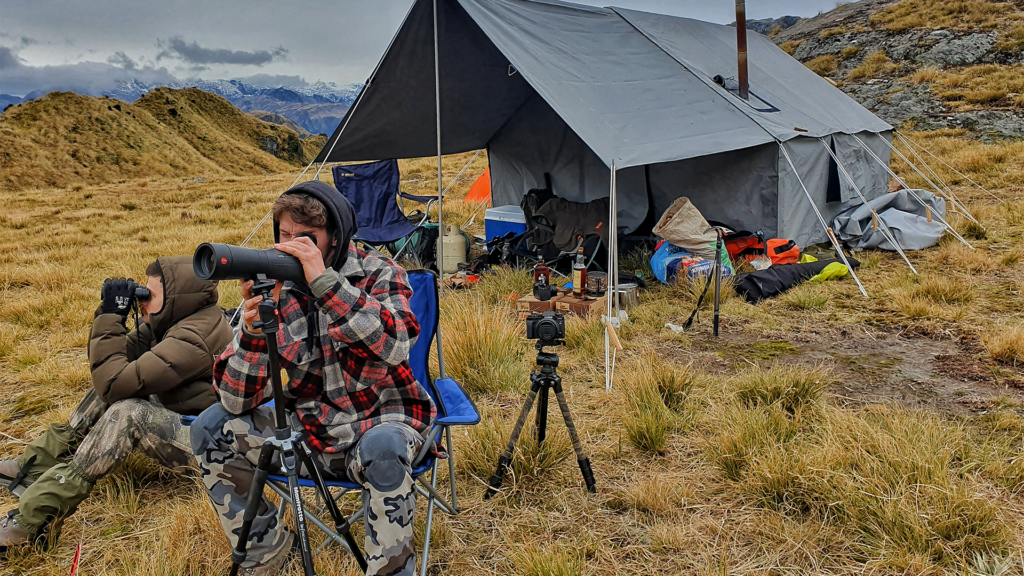 man taking photos at the drop camp site